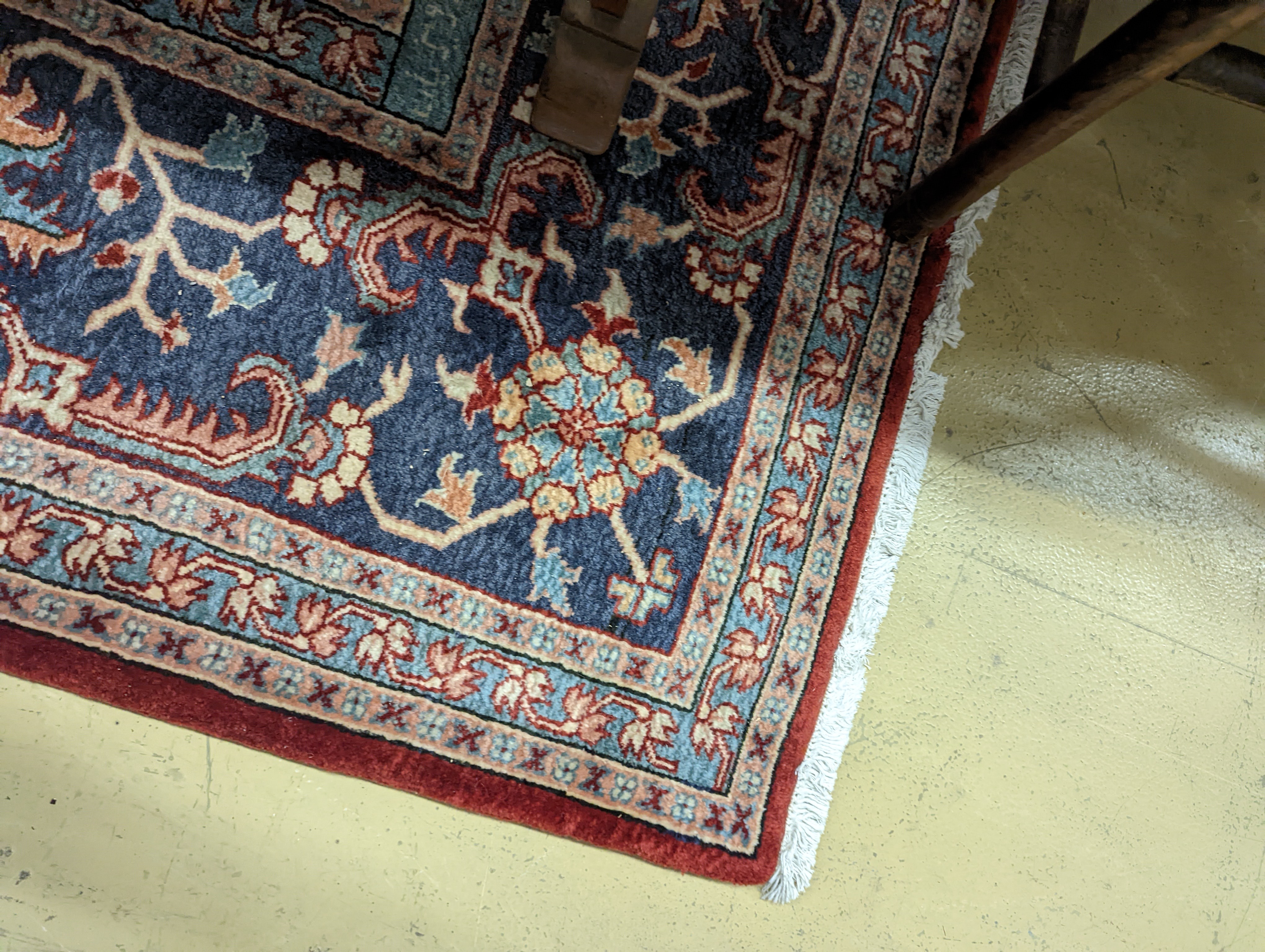 A large Caucasian style red ground carpet, 460 x 330cm